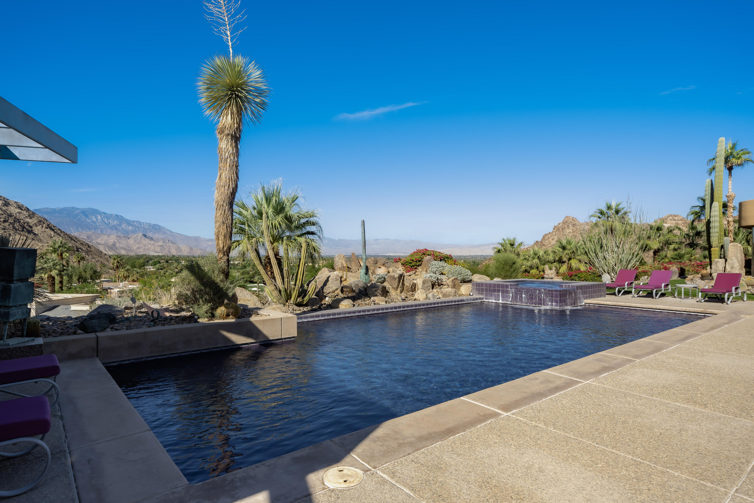 75270 Hidden Cove Indian Wells, CA 92210 - Photo 66 of 73 a view of a lake with a house in the background