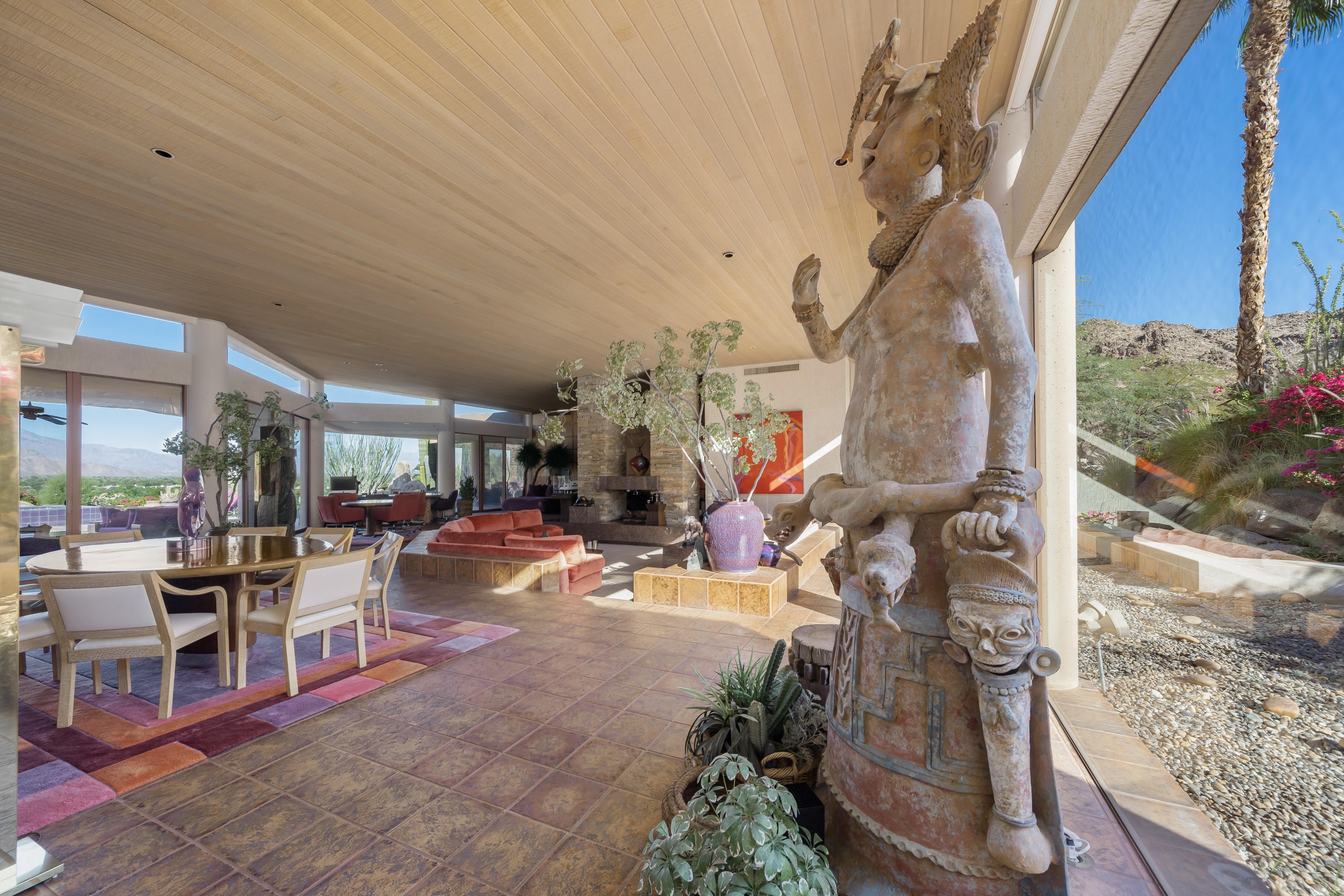 75270 Hidden Cove Indian Wells, CA 92210 - Photo 9 of 73 a view of a patio with dining table and chairs with plants