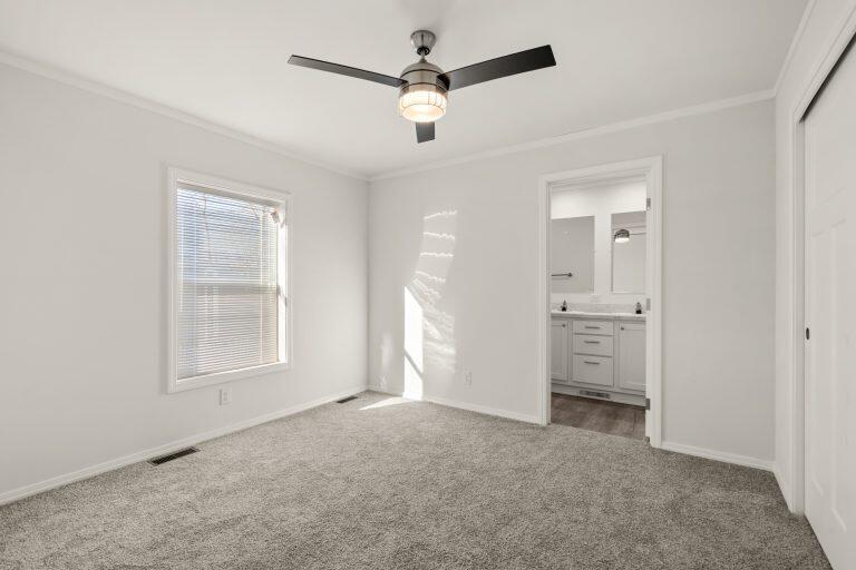 6850 Downing Road, Unit SPC 11 Central Point, OR 97502 - Photo 7 of 18 an empty room with windows and ceiling fan