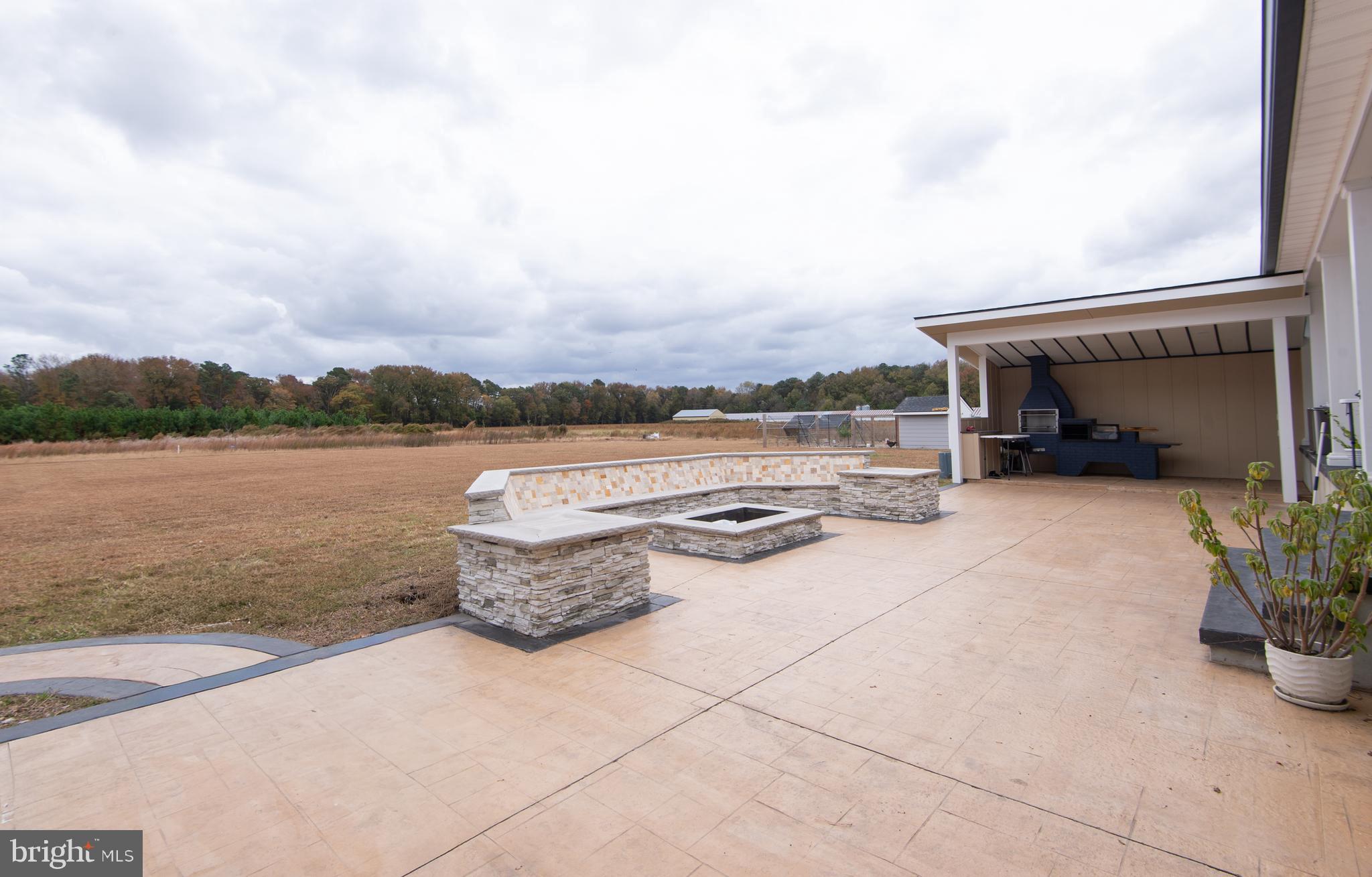 9509 Rum Ridge Road Delmar, MD 21875 - Photo 57 of 76 Custom stone bench seating and firepit