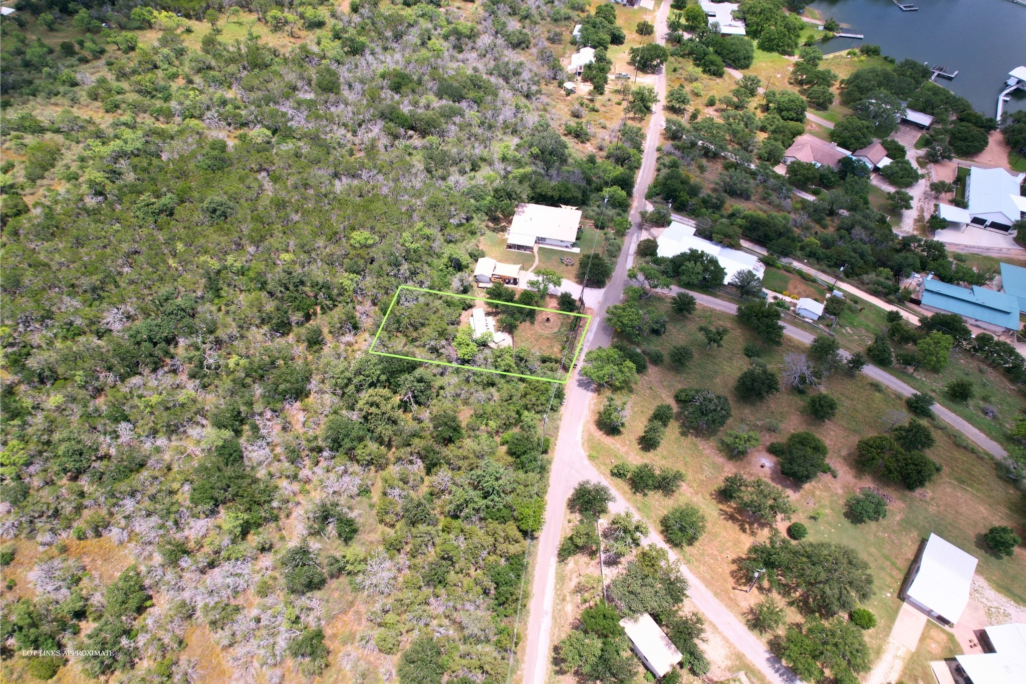 706 Cr138a Road Burnet, TX 78611 - Photo 8 of 18 A verdant, expansive lot provides a tranquil setting with ample space and nearby lake access.