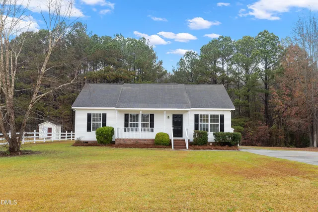 a view of a house with swimming pool and porch