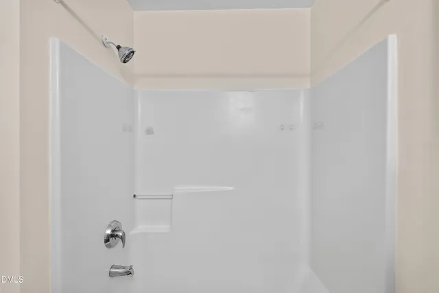 a bathroom with a granite countertop sink toilet and a mirror