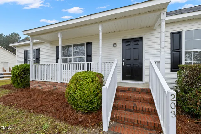a view of a swimming pool and lounge chairs