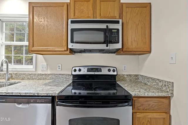 a kitchen with a sink and a window