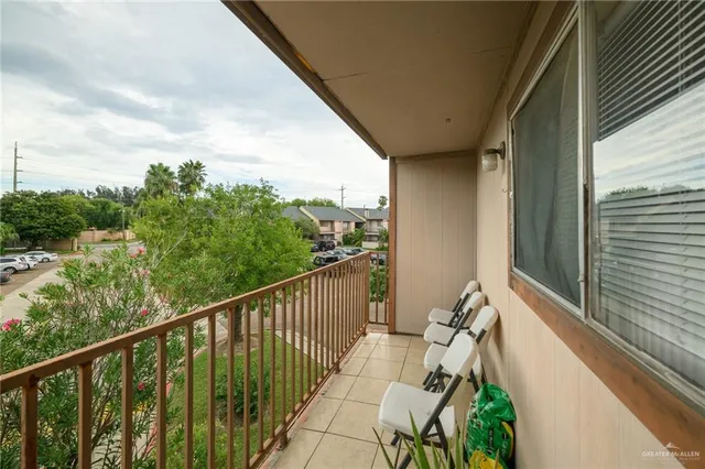 a view of balcony with furniture