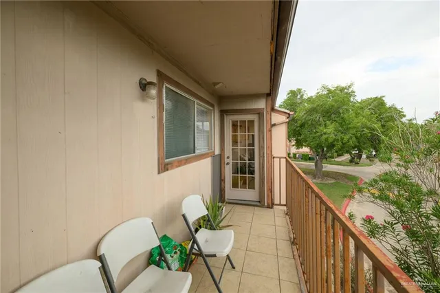 a view of a balcony with chairs
