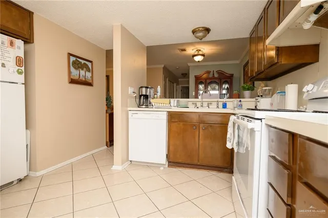a kitchen with cabinets and window
