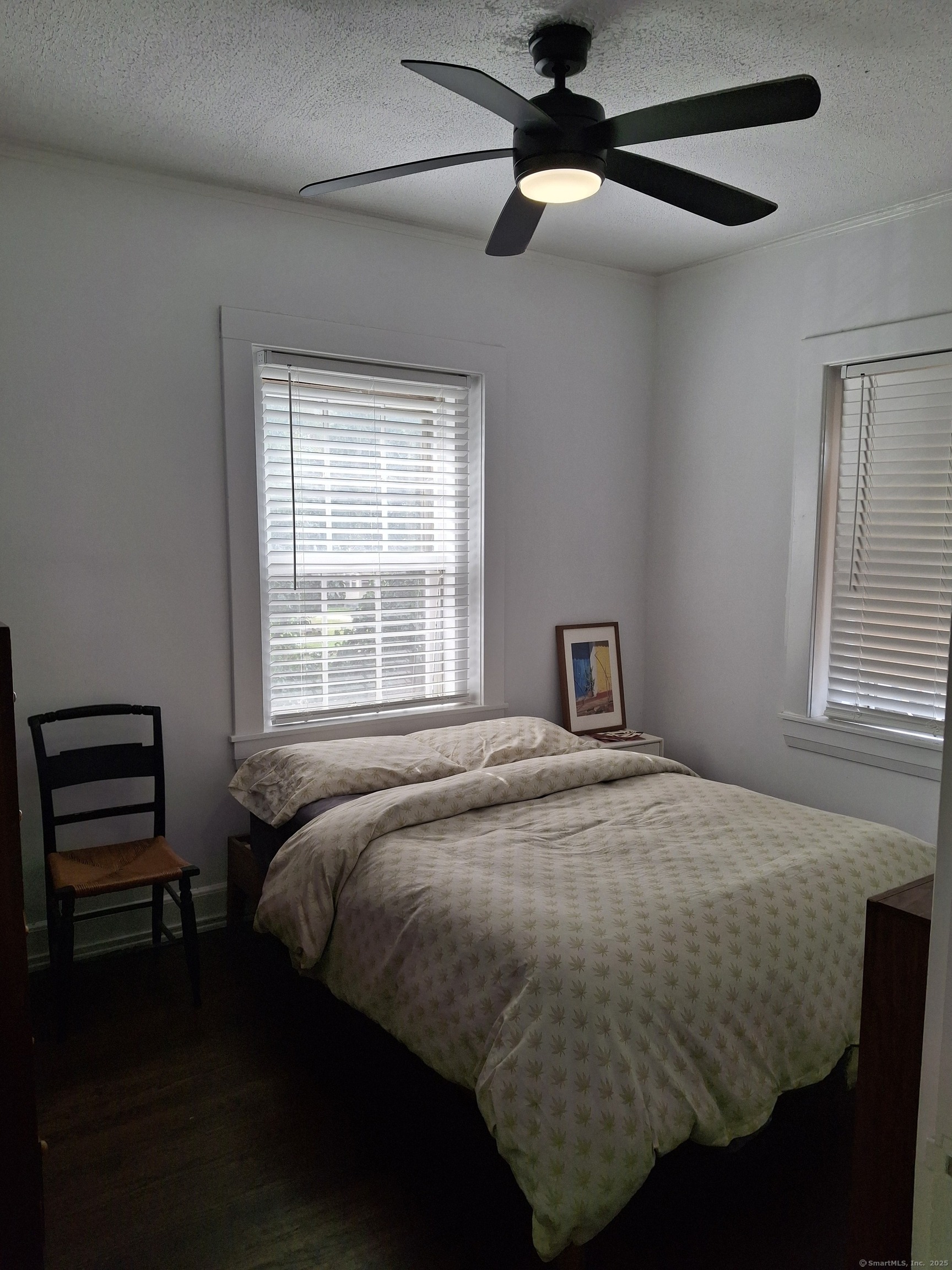 591 Wilmot Avenue, Unit 3 Bridgeport, CT 06607 - Photo 13 of 16 a bedroom with a bed and a window