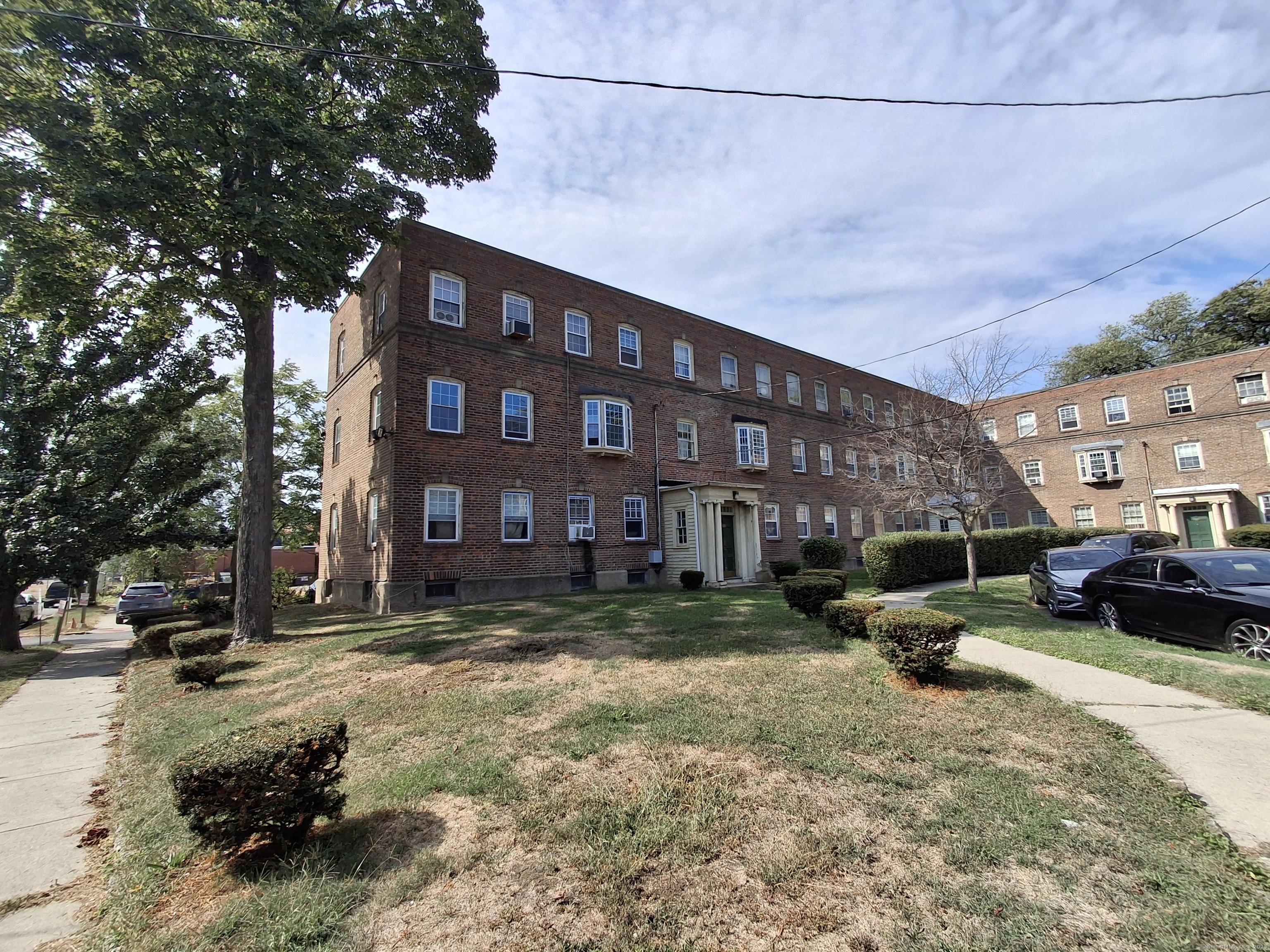 591 Wilmot Avenue, Unit 3 Bridgeport, CT 06607 - Photo 16 of 16 a view of a building with a yard