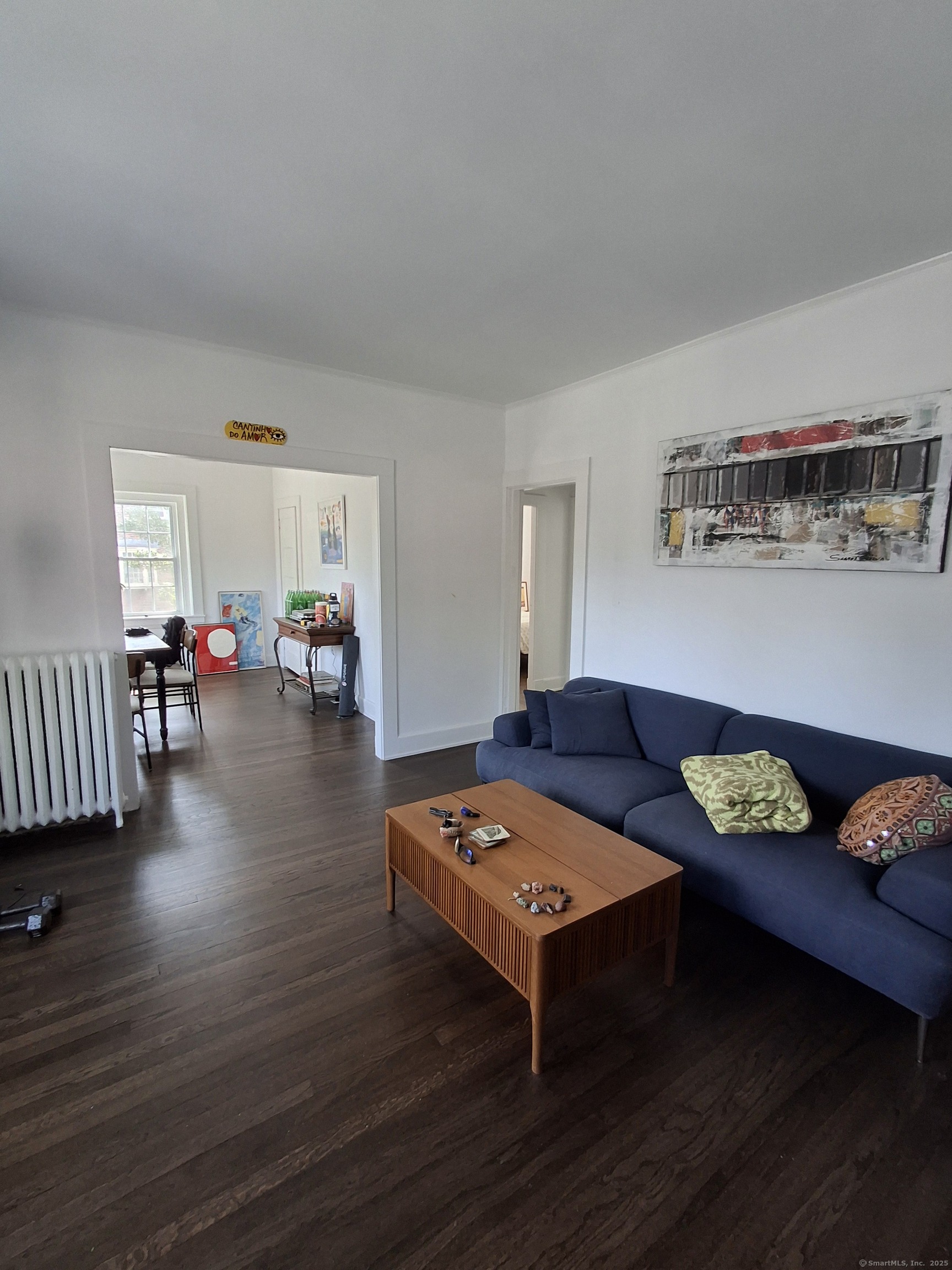 591 Wilmot Avenue, Unit 3 Bridgeport, CT 06607 - Photo 5 of 16 a living room with furniture and wooden floor