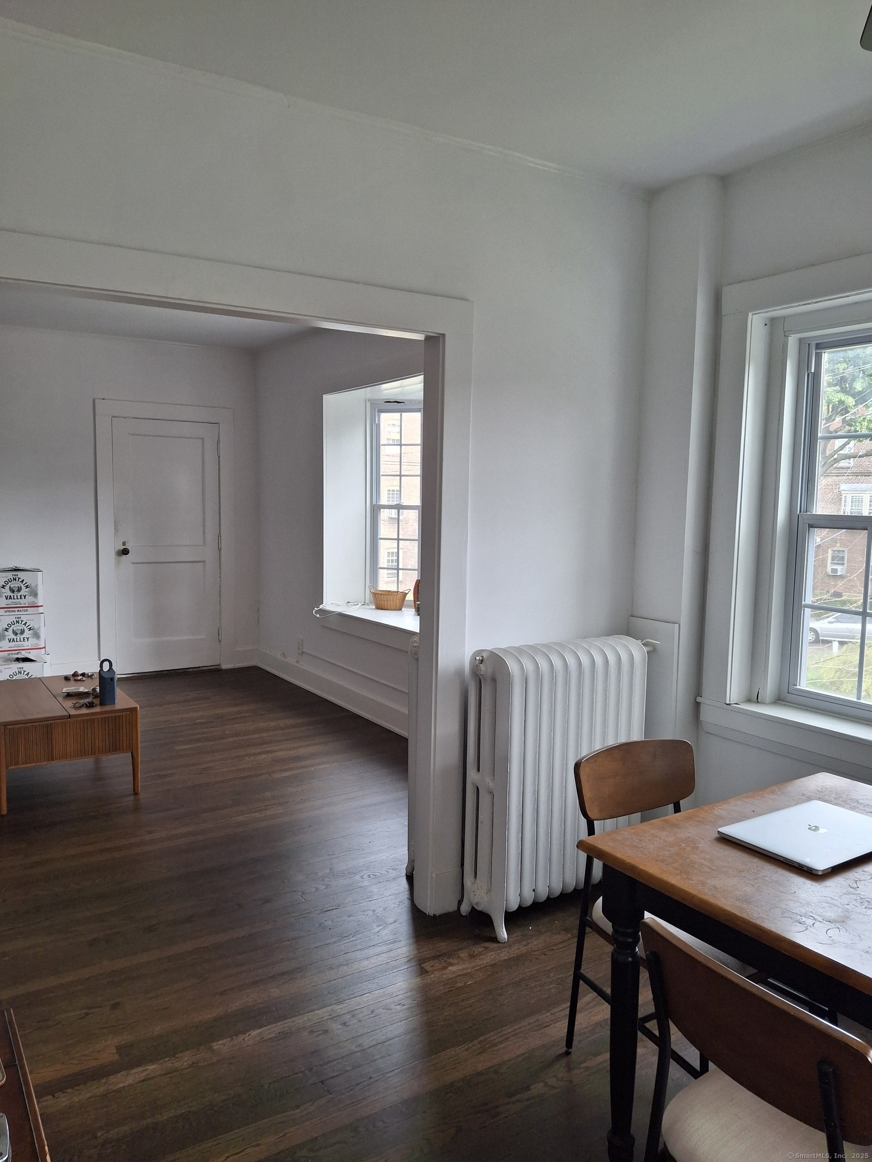591 Wilmot Avenue, Unit 3 Bridgeport, CT 06607 - Photo 9 of 16 a view of a dining room with furniture and wooden floor