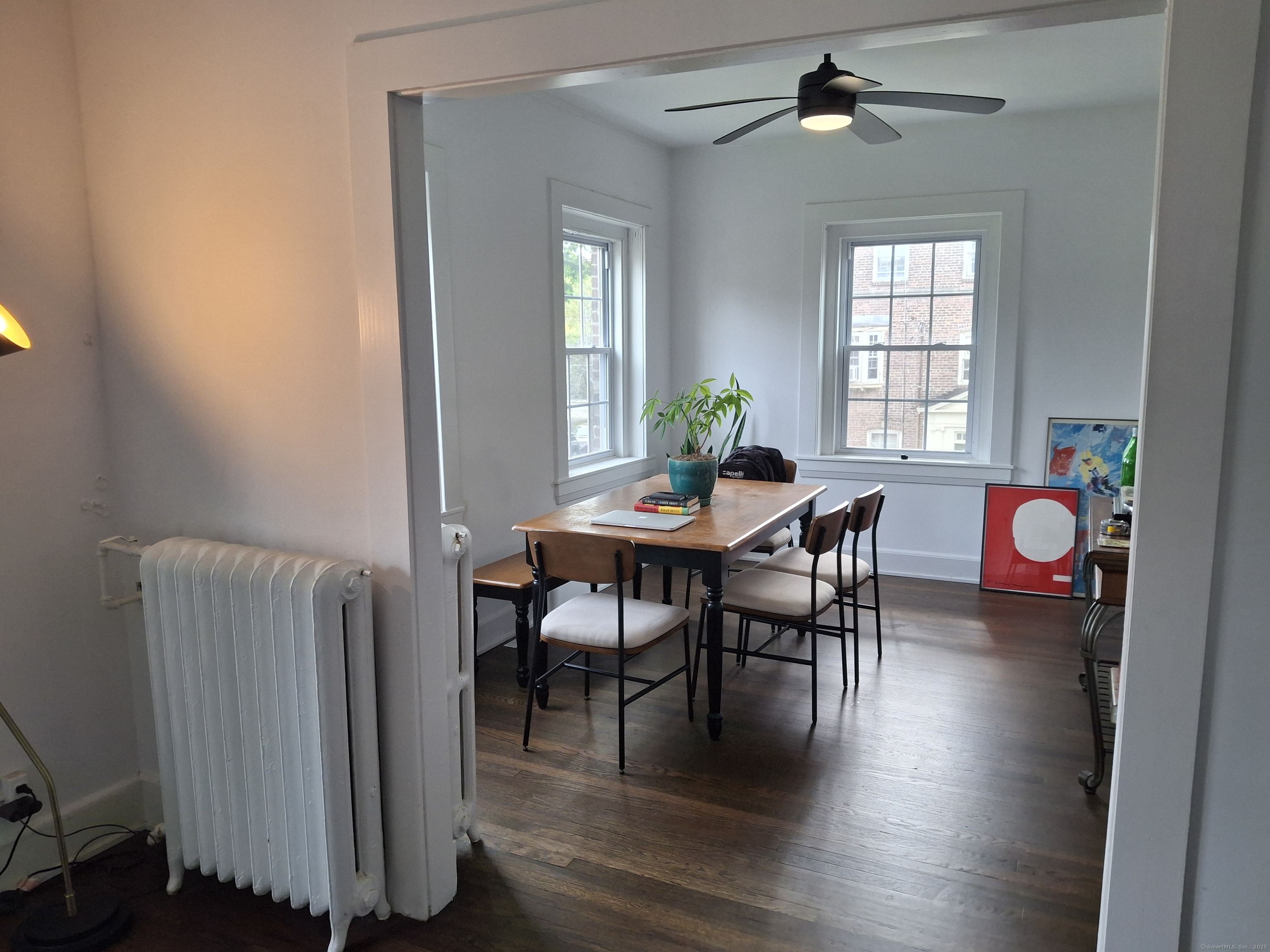 591 Wilmot Avenue, Unit 3 Bridgeport, CT 06607 - Photo 10 of 16 a view of a dining room with furniture window and wooden floor