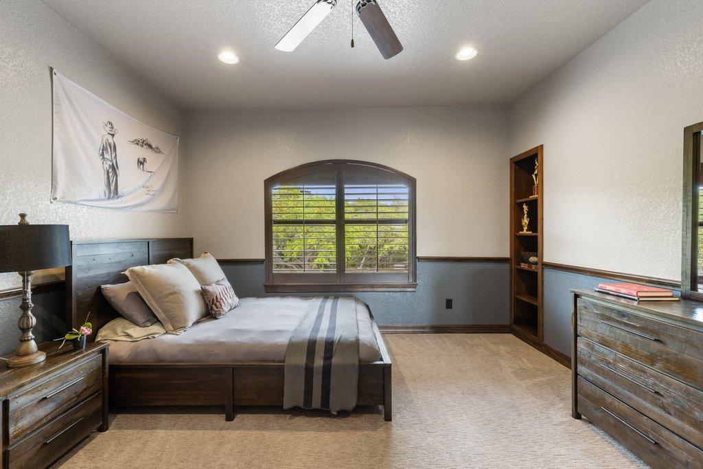 1540 County Road 262 Georgetown, TX 78633 - Photo 19 of 40 The fourth bedroom features a built-in bookcase and a private ensuite bathroom.