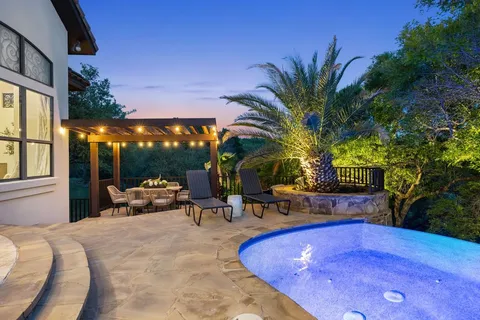 a view of outdoor space with swimming pool and furniture