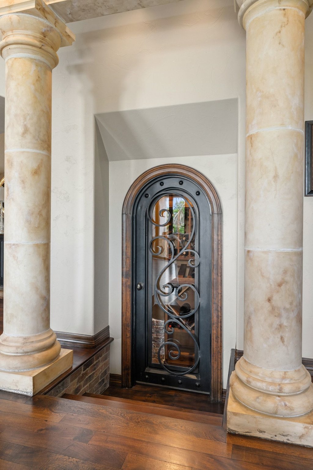 1540 County Road 262 Georgetown, TX 78633 - Photo 34 of 40 Elegant columns guide you to a custom-built walk-in wine cellar.