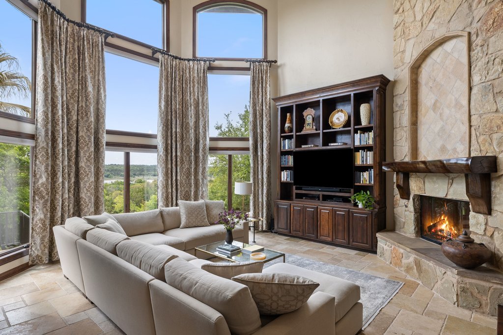 1540 County Road 262 Georgetown, TX 78633 - Photo 5 of 40 The first living space captivates with a towering stone fireplace.