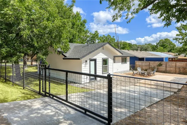 a view of house with outdoor space and sitting area