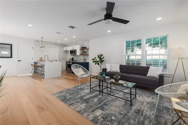 a living room with furniture and a large window