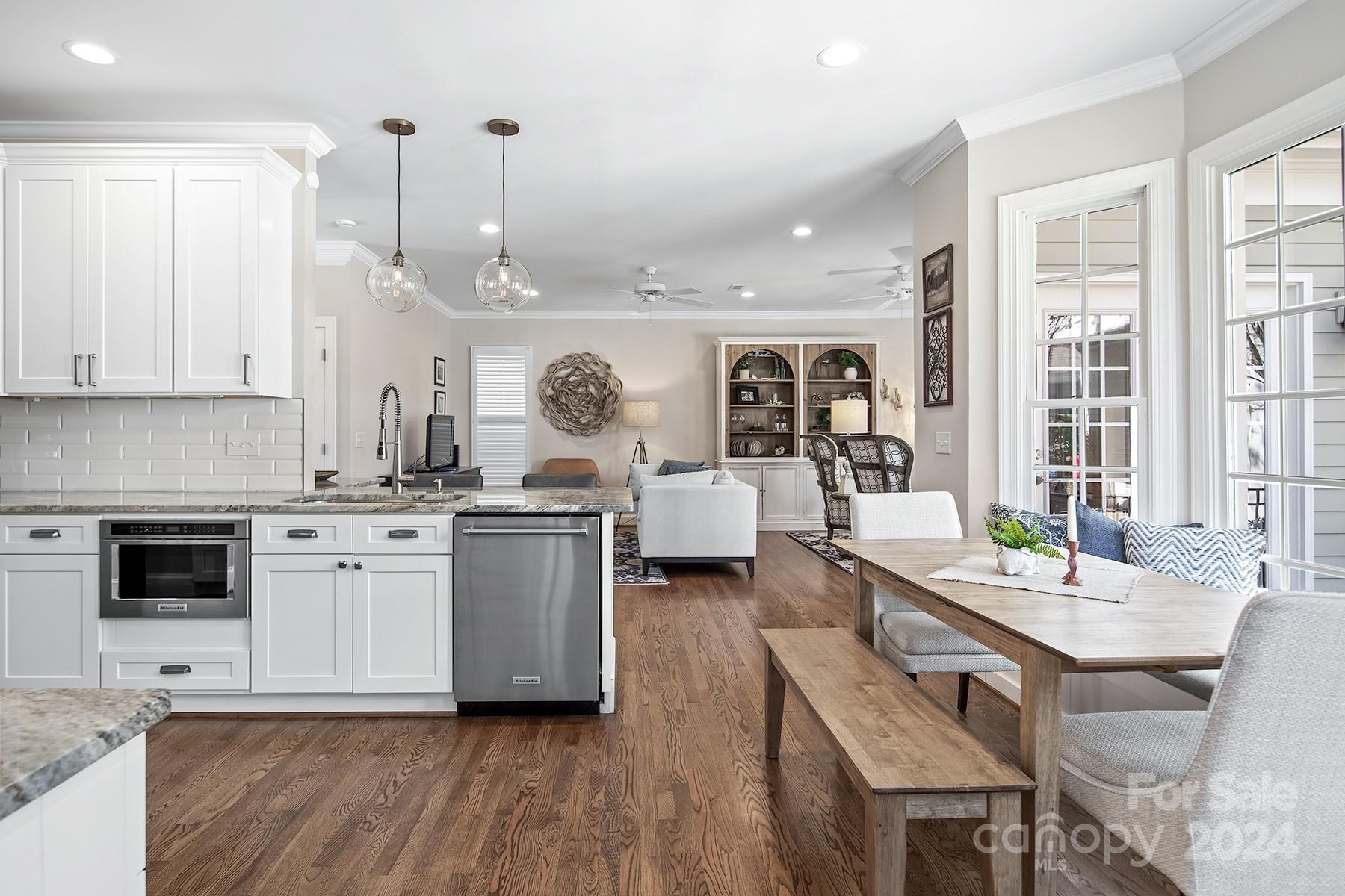 544 Ashby Drive Davidson, NC 28036 - Photo 13 of 40 a living room with furniture a fireplace and kitchen view