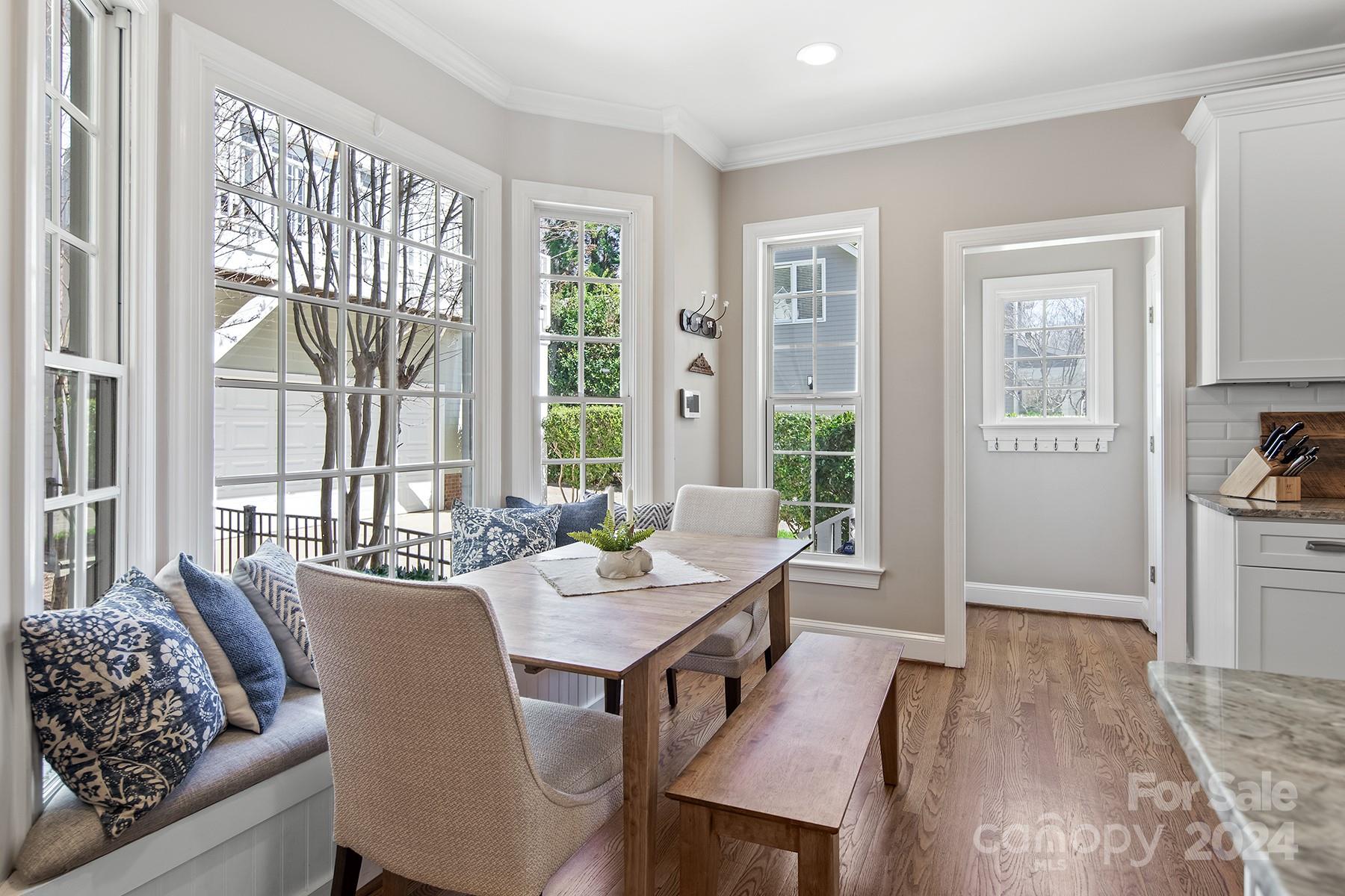 544 Ashby Drive Davidson, NC 28036 - Photo 14 of 40 a view of a dining room with furniture window and wooden floor
