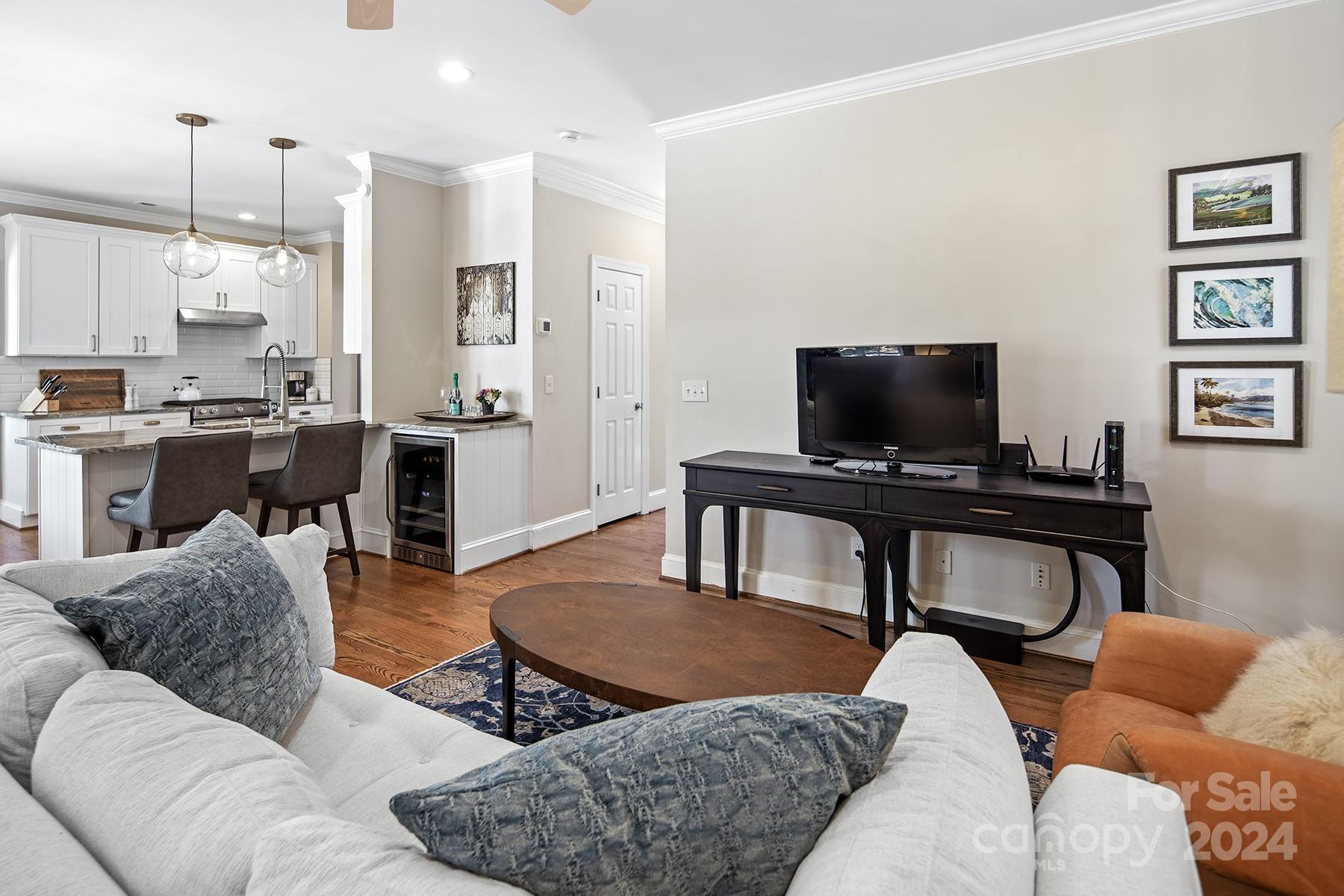 544 Ashby Drive Davidson, NC 28036 - Photo 17 of 40 a living room with furniture a rug and a flat screen tv