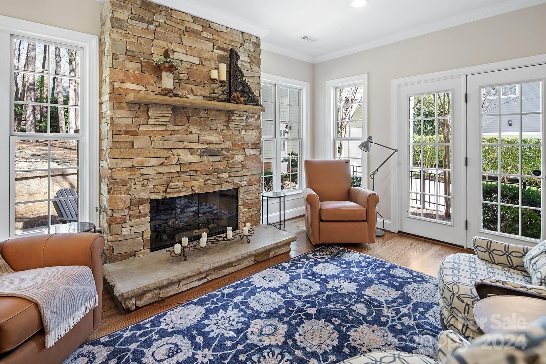 544 Ashby Drive Davidson, NC 28036 - Photo 19 of 40 a living room with furniture and a fireplace