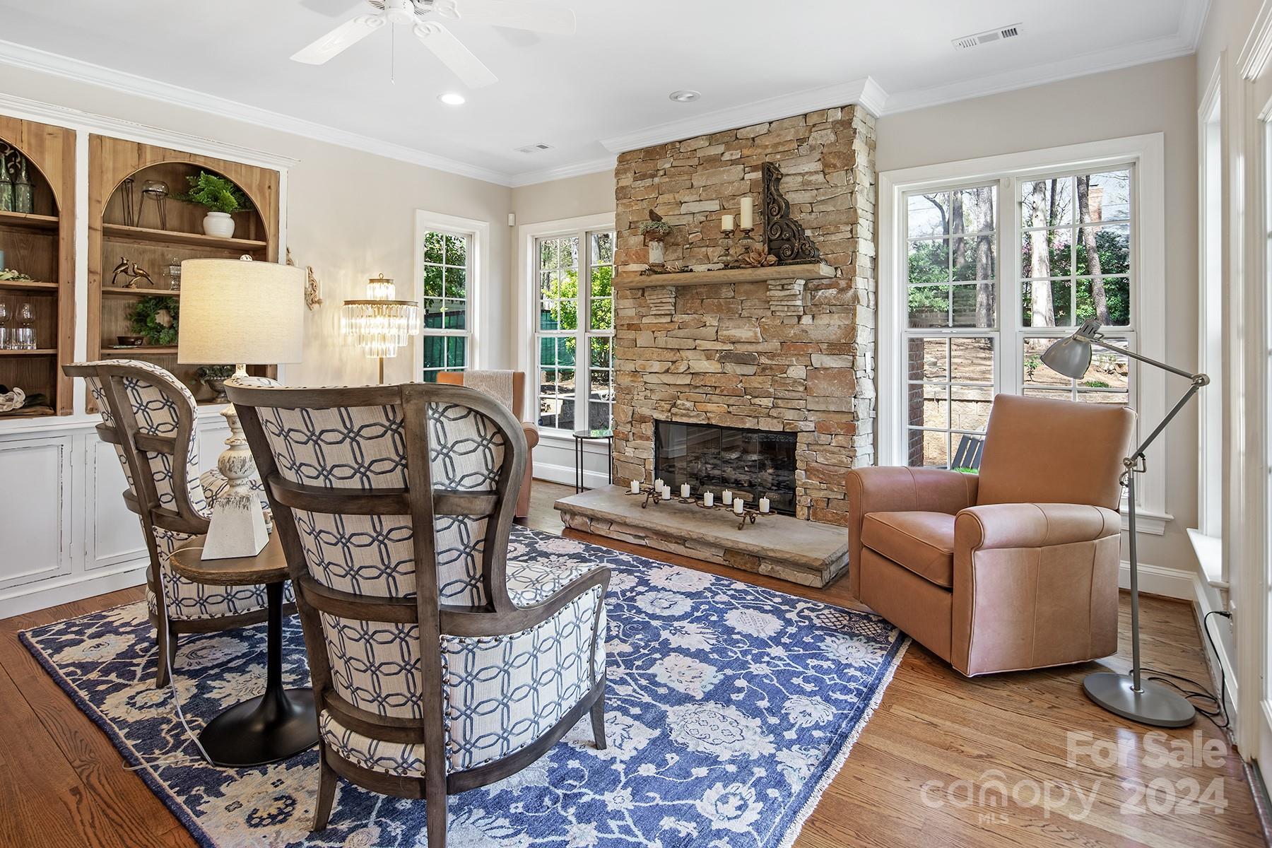 544 Ashby Drive Davidson, NC 28036 - Photo 20 of 40 a living room with furniture a window and a fireplace