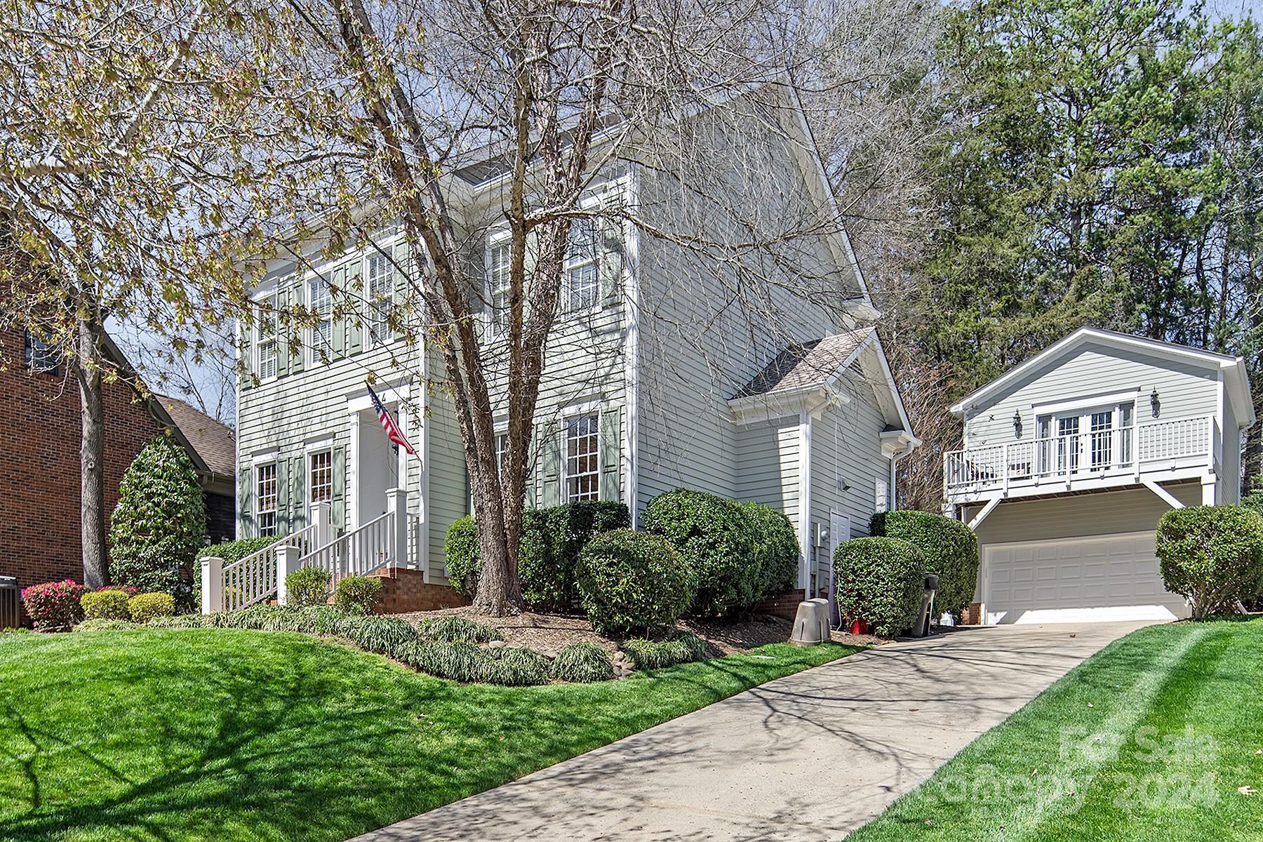 544 Ashby Drive Davidson, NC 28036 - Photo 3 of 40 a front view of a house with garden