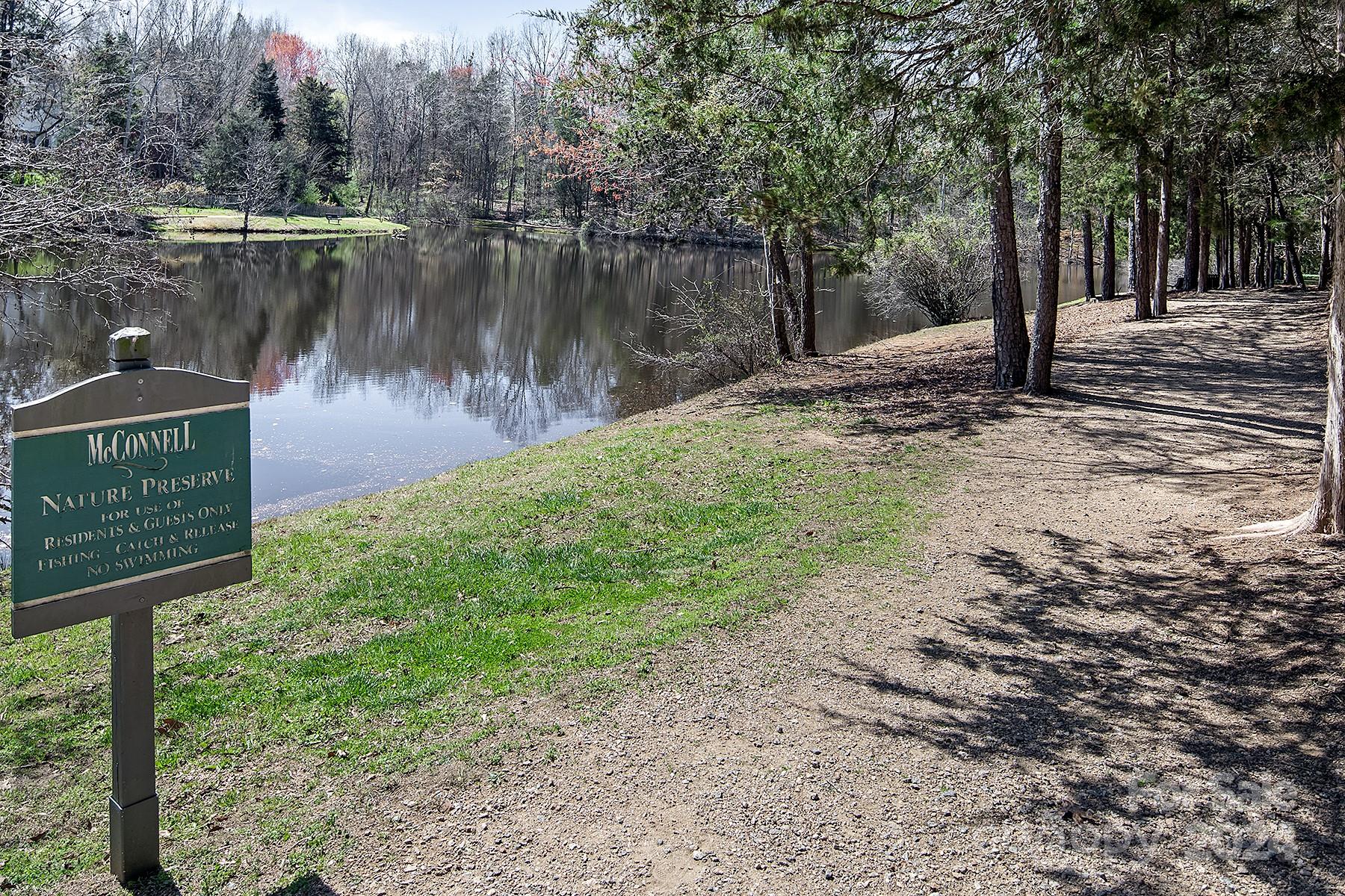 544 Ashby Drive Davidson, NC 28036 - Photo 40 of 40 a view of a street with a yard and large trees