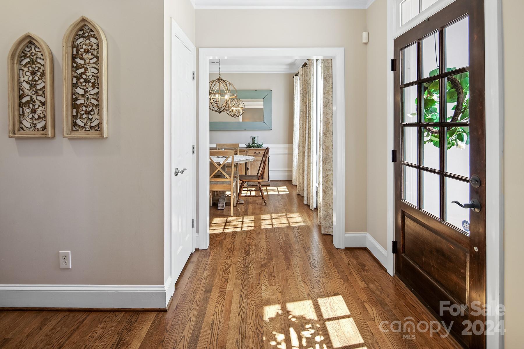 544 Ashby Drive Davidson, NC 28036 - Photo 5 of 40 a view of a hallway with wooden floor and furniture
