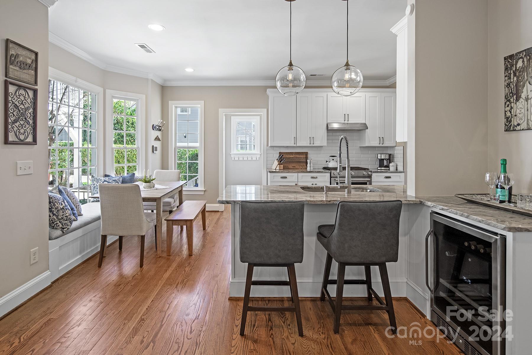 544 Ashby Drive Davidson, NC 28036 - Photo 9 of 40 a view of a dining room with furniture window and wooden floor