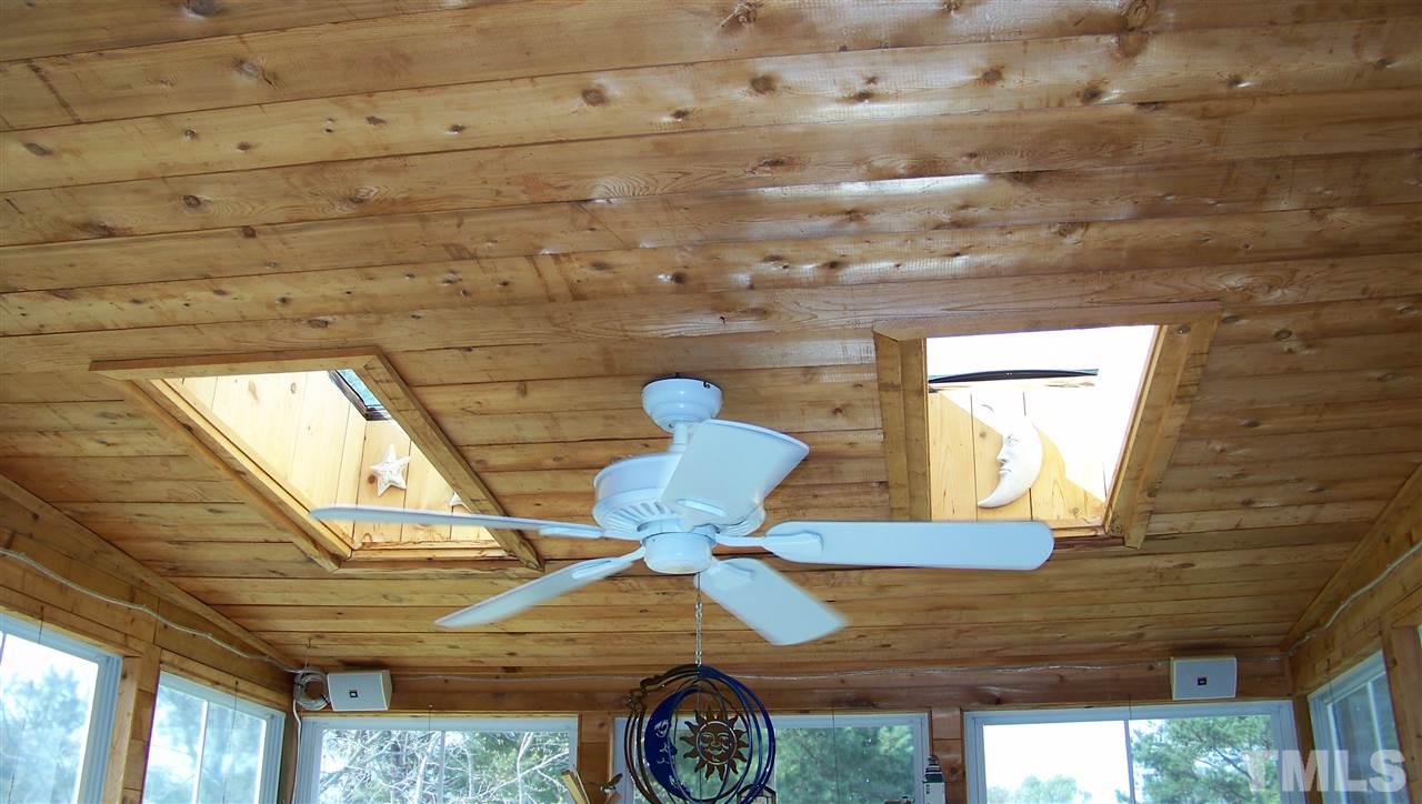 409 South Meadow Road Raleigh, NC 27603 - Photo 14 of 25 Check out the ceiling for the three-season room. Beautiful pine wood, skylights and a ceiling fan. The sky is the limit for what you could do with this room!