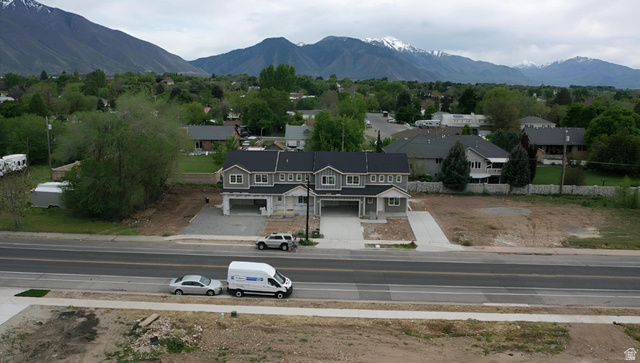 630 East 800 S Street Springville, UT 84663 - Photo 3 of 5 New construction townhome development featuring a gray facade, white trim, and dark roofing