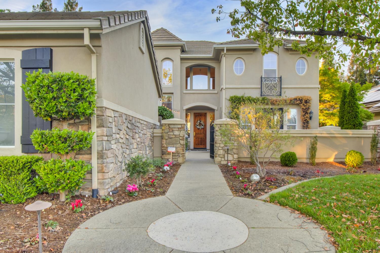 8055 Chestnut Court Granite Bay, CA 95746 - Photo 1 of 1 a front view of a house with garden