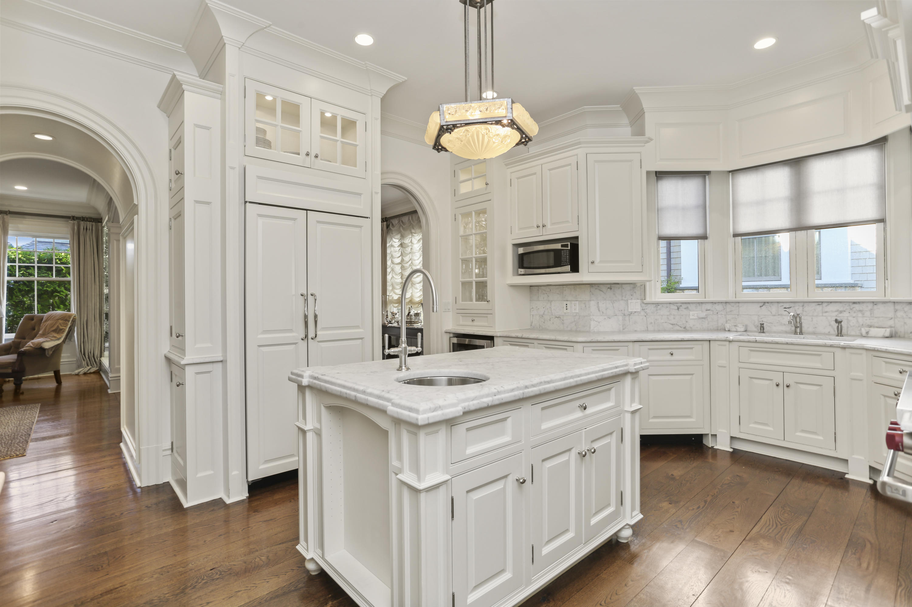 50 Sound View Drive, Unit 2 SOUTH Greenwich, CT 06830 - Photo 3 of 21 a kitchen with white cabinets and stainless steel appliances