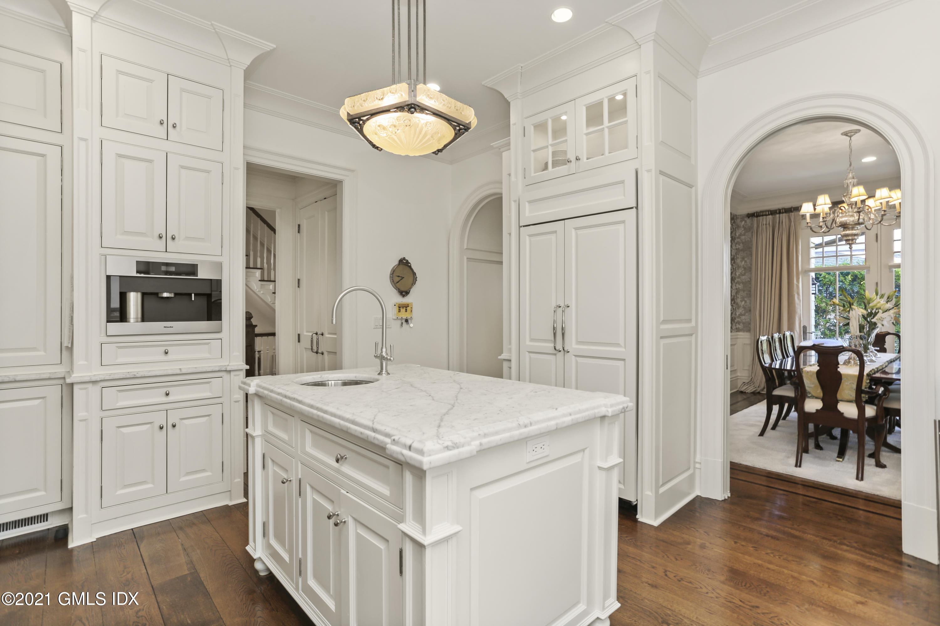50 Sound View Drive, Unit 2 SOUTH Greenwich, CT 06830 - Photo 4 of 21 a kitchen that has a lot of cabinets a sink and wooden floor