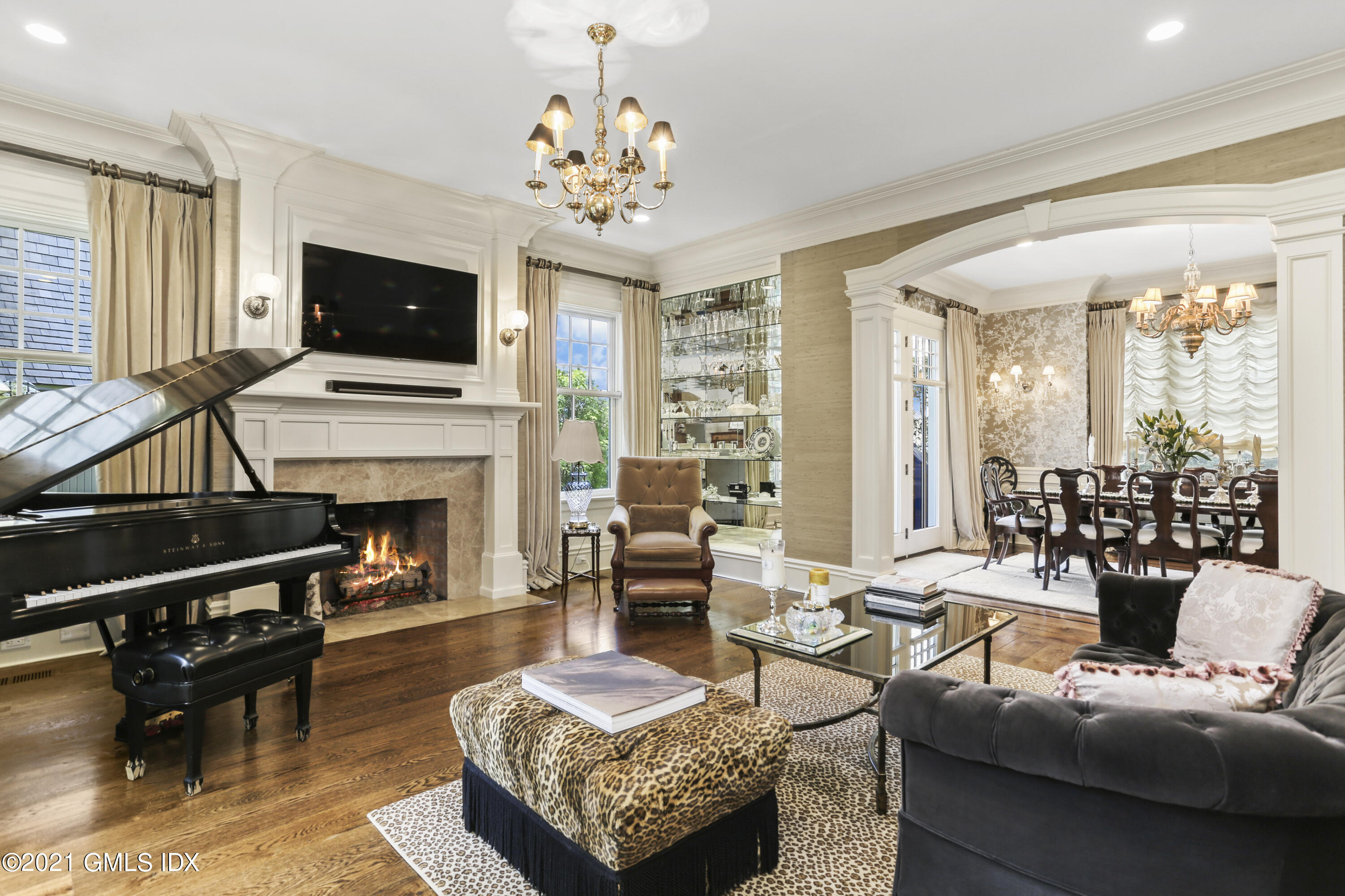 50 Sound View Drive, Unit 2 SOUTH Greenwich, CT 06830 - Photo 6 of 21 a living room with furniture a fireplace and a flat screen tv