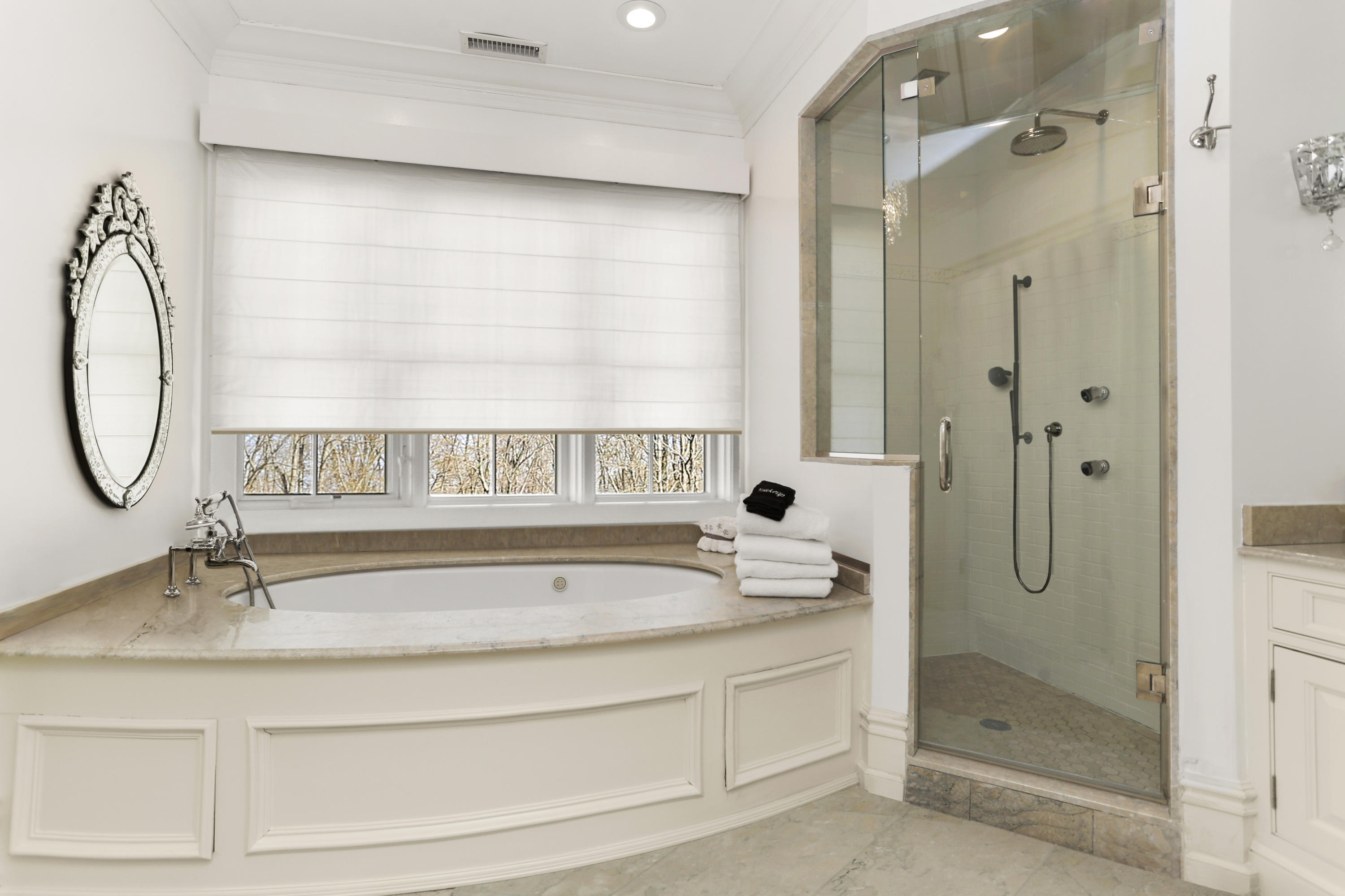 50 Sound View Drive, Unit 2 SOUTH Greenwich, CT 06830 - Photo 10 of 21 a bathroom with a tub sink and mirror
