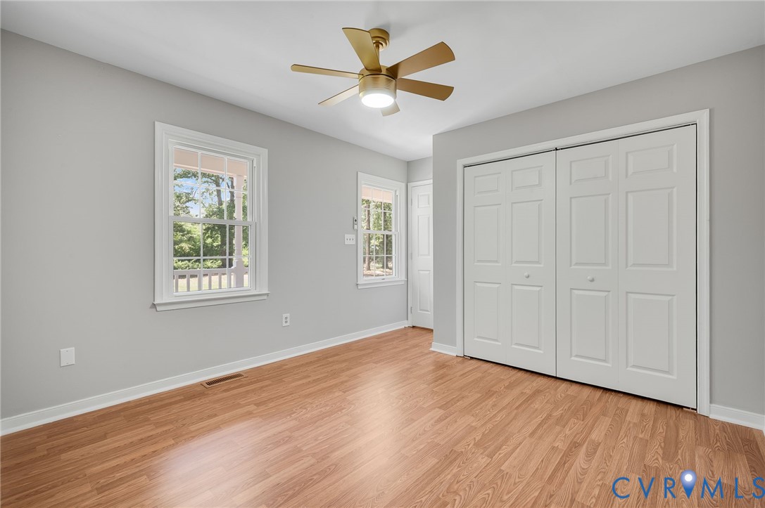 10110 Holly Road Mechanicsville, VA 23116 - Photo 17 of 26 Spacious room featuring wood-finish flooring, ligh
