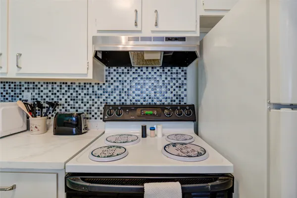 a bathroom with a sink and a microwave