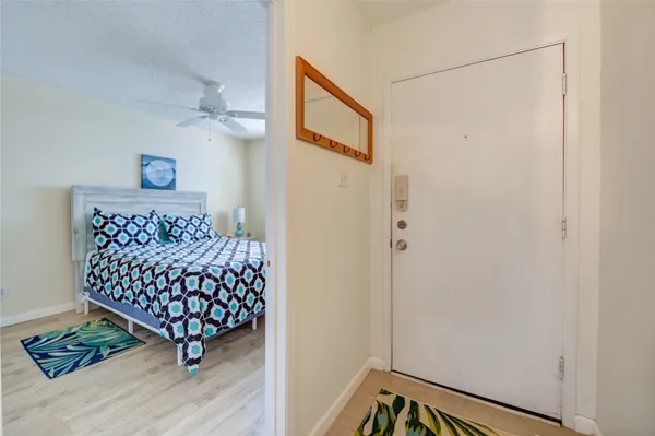 a room with wooden floor and furniture