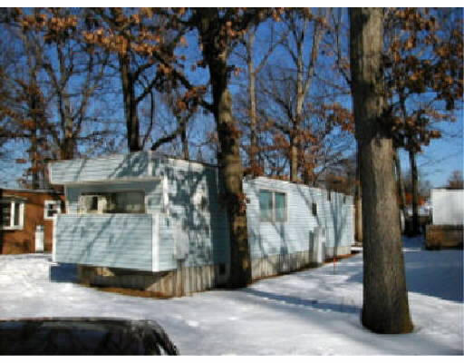 75 Mobile Home Way Springfield, MA 01119 - Photo 1 of 1 a view of a street with houses