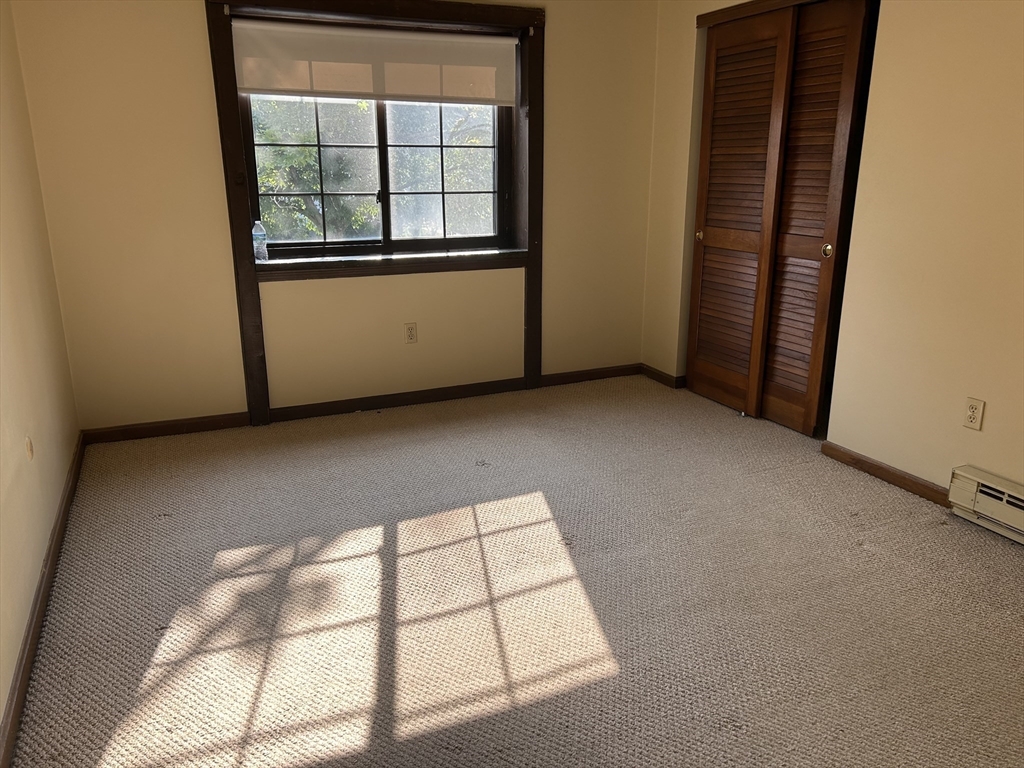 75 Winthrop Street, Unit 334 Everett, MA 02149 - Photo 5 of 8 an empty room with windows
