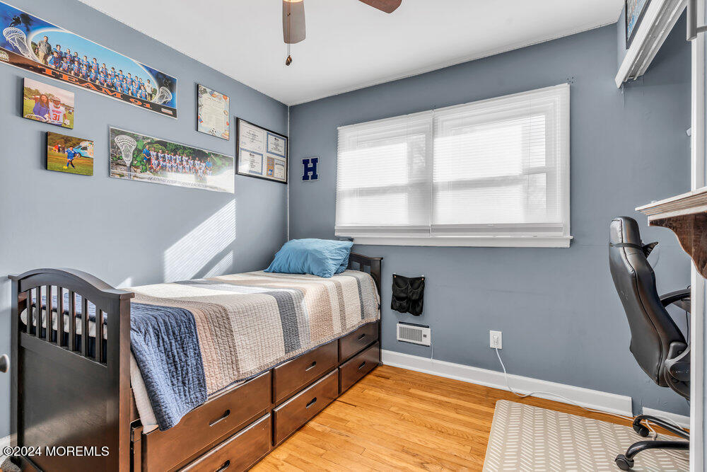 56 Bethany Road Holmdel, NJ 07733 - Photo 11 of 19 a bedroom with a bed next to a window