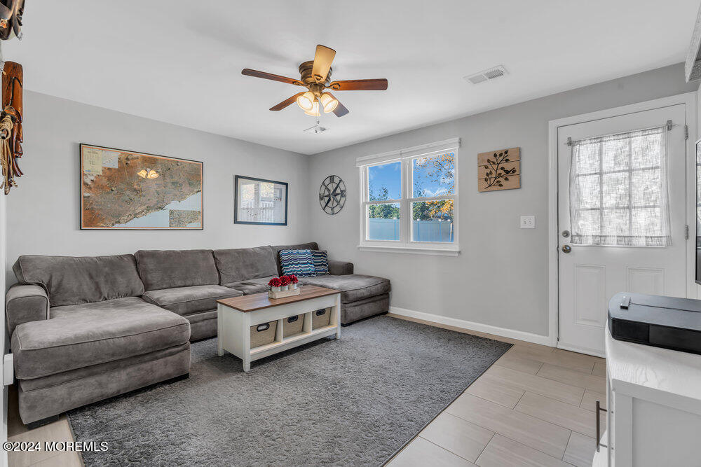 56 Bethany Road Holmdel, NJ 07733 - Photo 13 of 19 a living room with furniture and window