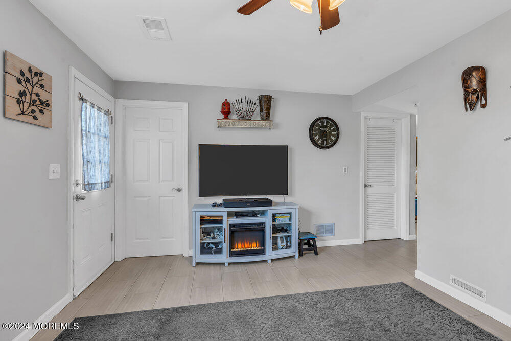 56 Bethany Road Holmdel, NJ 07733 - Photo 14 of 19 a view of a livingroom with furniture and window