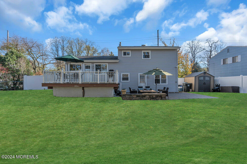 56 Bethany Road Holmdel, NJ 07733 - Photo 18 of 19 a view of a house with backyard and a tree