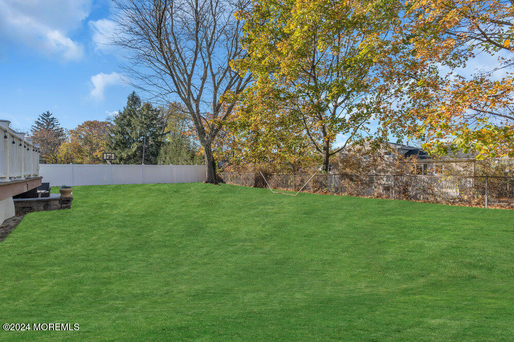 56 Bethany Road Holmdel, NJ 07733 - Photo 19 of 19 a view of yard with grass and trees