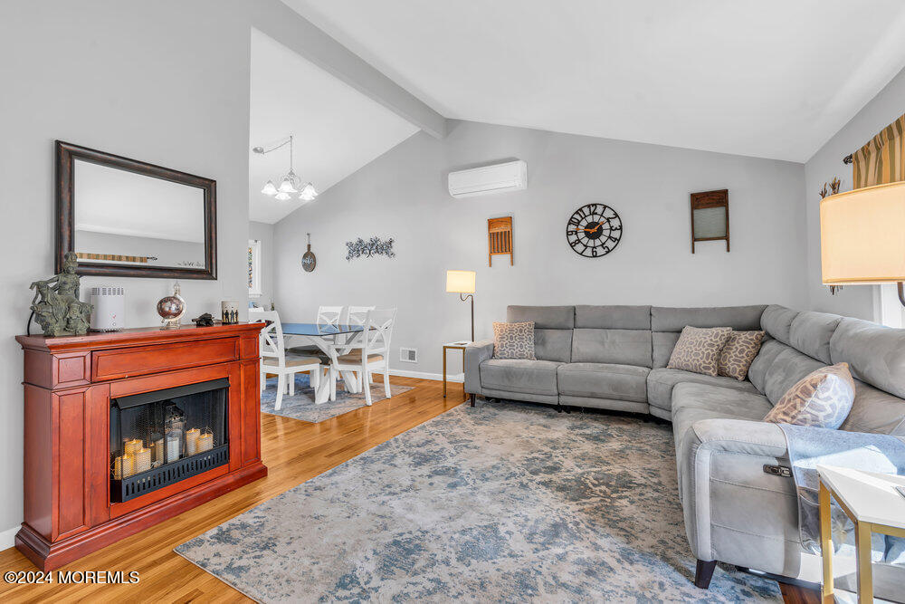 56 Bethany Road Holmdel, NJ 07733 - Photo 3 of 19 a living room with furniture and a fireplace